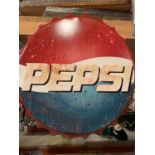 A PEPSI BOTTLE TOP WALL HANGING SIGN