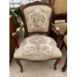 A CONTINENTAL STYLE OPEN ARM CHAIR WITH PROFUSE FLORAL DECORATION