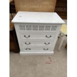 A WHITE PAINTED CHEST OF THREE DRAWERS WITH PIERCED FRETWORK FRONT - 30" WIDE