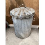 A VINTAGE GALVANISED DUST BIN WITH LID