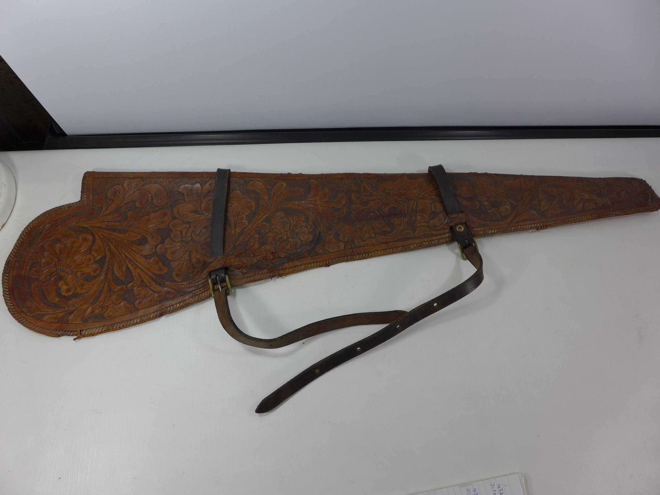 A LEATHER RIFLE SLIP WITH FLORAL DECORATION, LENGTH 103CDM