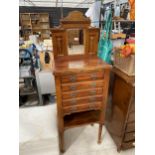 A LATE VICTORIAN SATINWOOD MIRROR-BACK CHEST OF FIVE DRAWERS WITH AN OPEN BASE