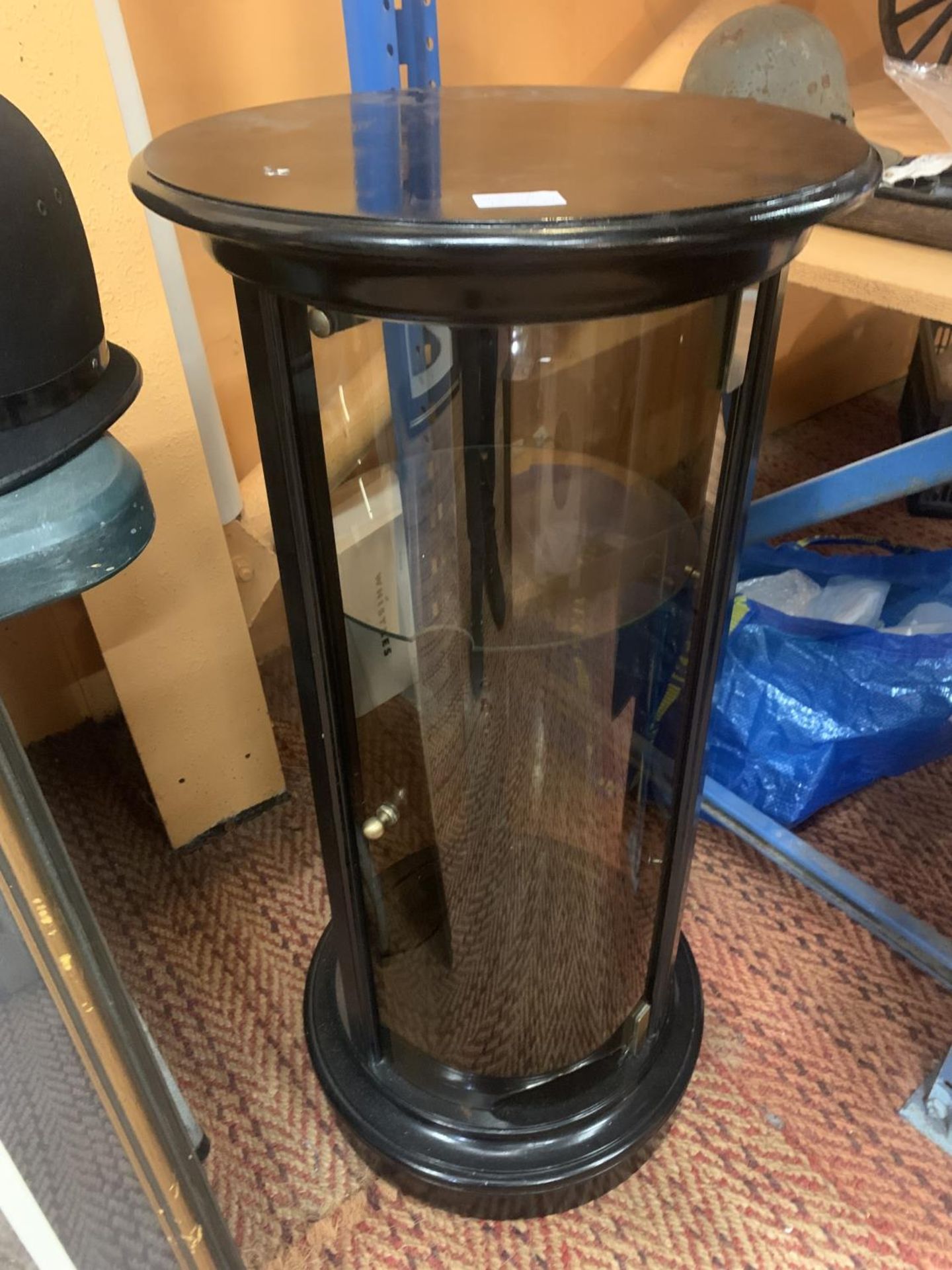 A MAHOGANY CIRCULAR DISPLAY CUPBOARD (GLASS A/F)