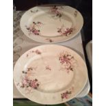 TWO LARGE HEAVY CERAMIC MEAT PLATTERS WITH A DELICATE PINK FLOWER DESIGN