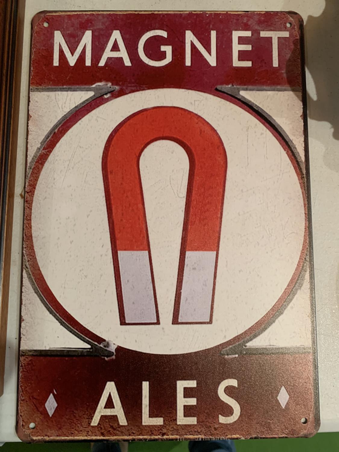 A MAGNET ALES METAL SIGN