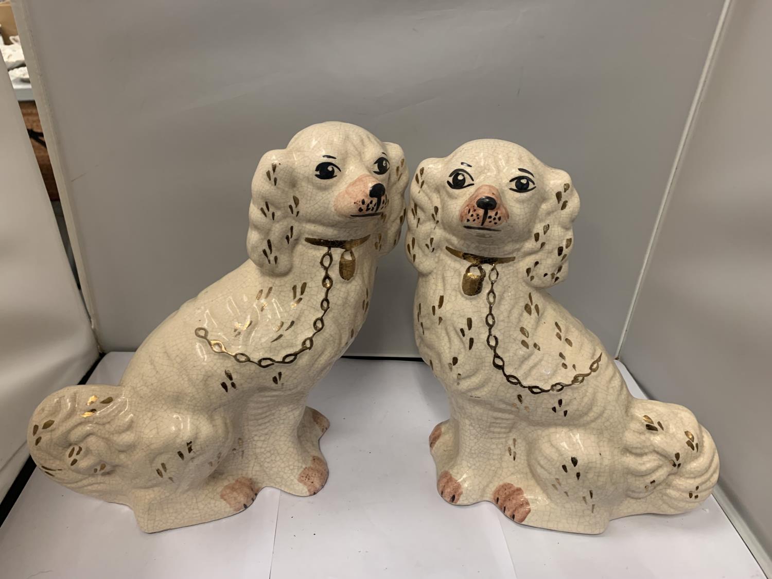 A PAIR OF STAFFORDSHIRE FLAT BACK SPANIELS APPROX 32CM HIGH