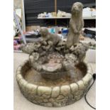 A STONE EFFECT GARDEN WATER FEATURE WITH TWO OTTERS