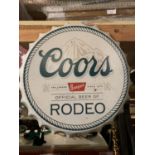 A VINTAGE STYLE COORS BOTTLE TOP WALL HANGING
