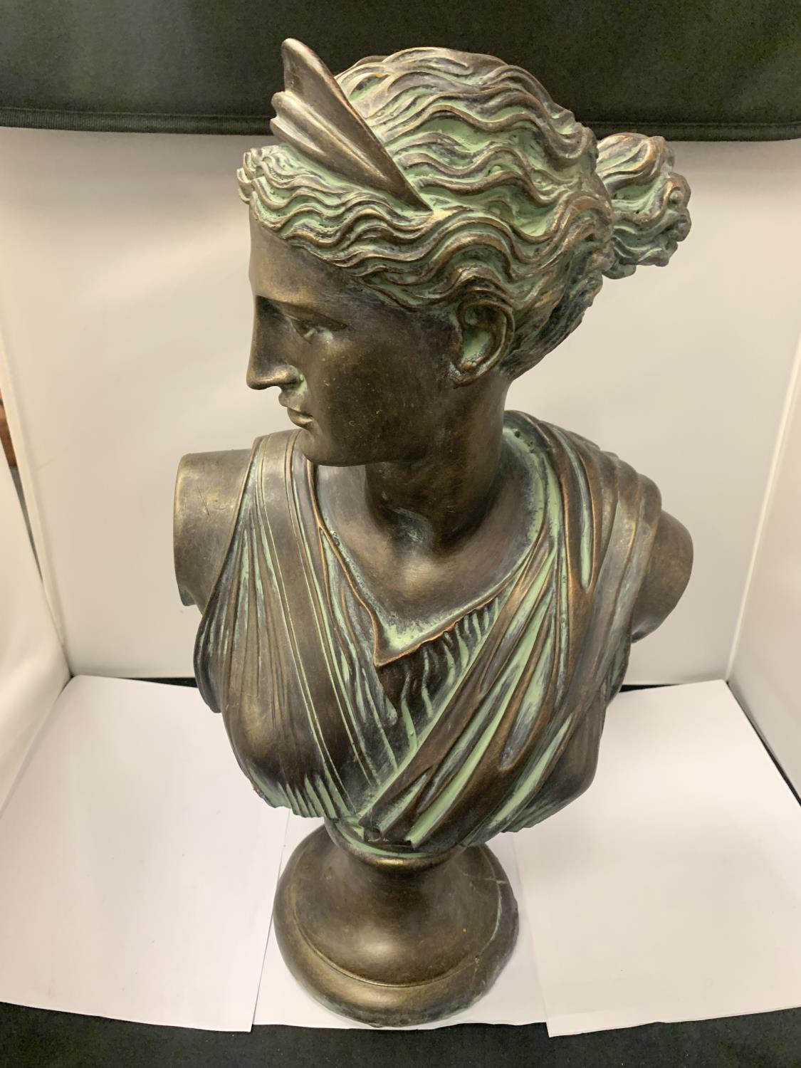 A LARGE BRONZE EFFECT STONE BUST OF 'DIANA' 53CM HEIGHT