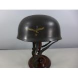 A GERMAN PARATROOPERS HELMET WITH EAGLE & SWASTIKA DECAL