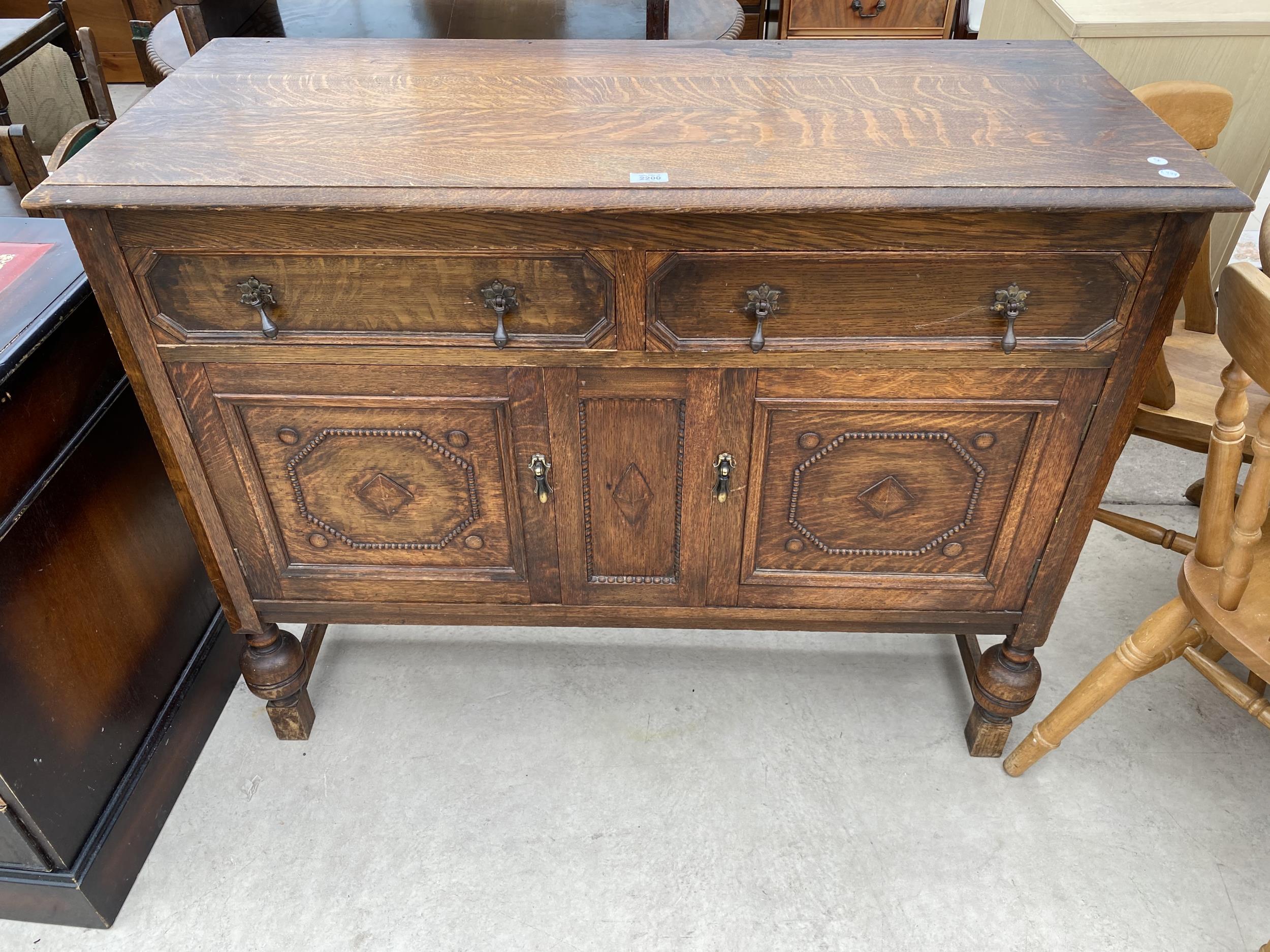 AN EARLY 20TH CENTURY OAK SIDEBOARD 48" WIDE