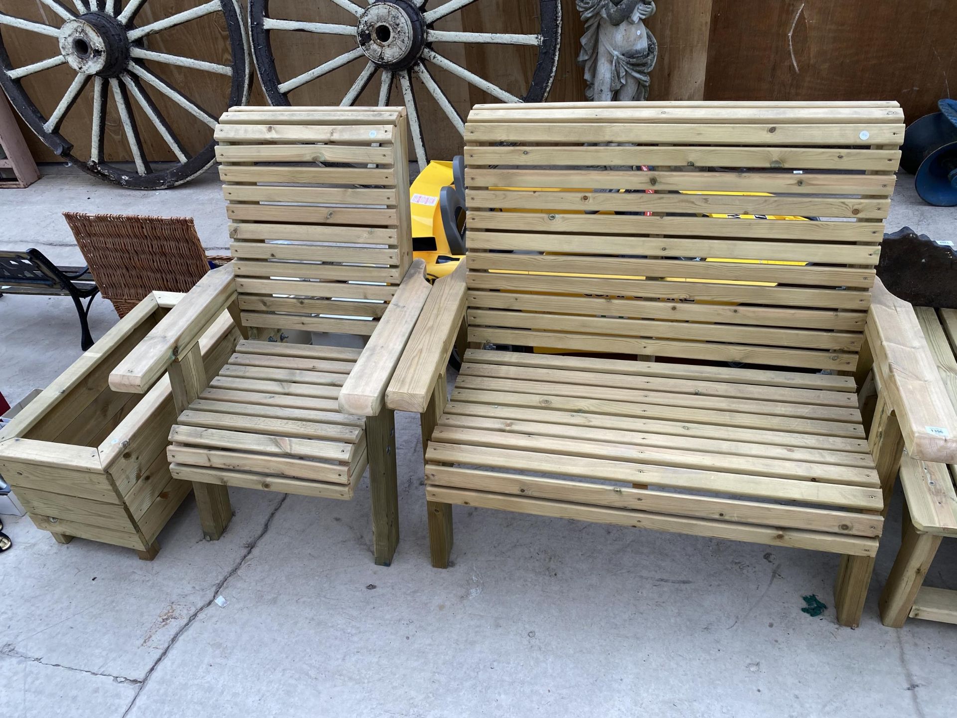A WOODEN GARDEN FURNITURE SET TO INCLUDE A TWO SEATER BENCH, A CHAIR AND A PLANTER