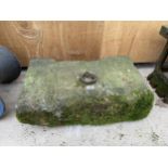 A VINTAGE STONE CHEESE BLOCK WITH HANGING HOOP