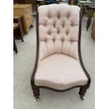 A VICTORIAN MAHOGANY LOW NURSING CHAIR ON TURNED FRONT LEGS