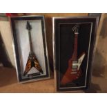 TWO MINIATURE BOX FRAMED GUITARS REPLICATING METALLICA JAMES HETFIELDS ESP HOT ROD AND U2'S THE EDGE