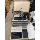 A MELODY BOY 1000 RADIO AND TWO TEXAS INSTRUMENTS TI-99/4A TYPEWRITERS