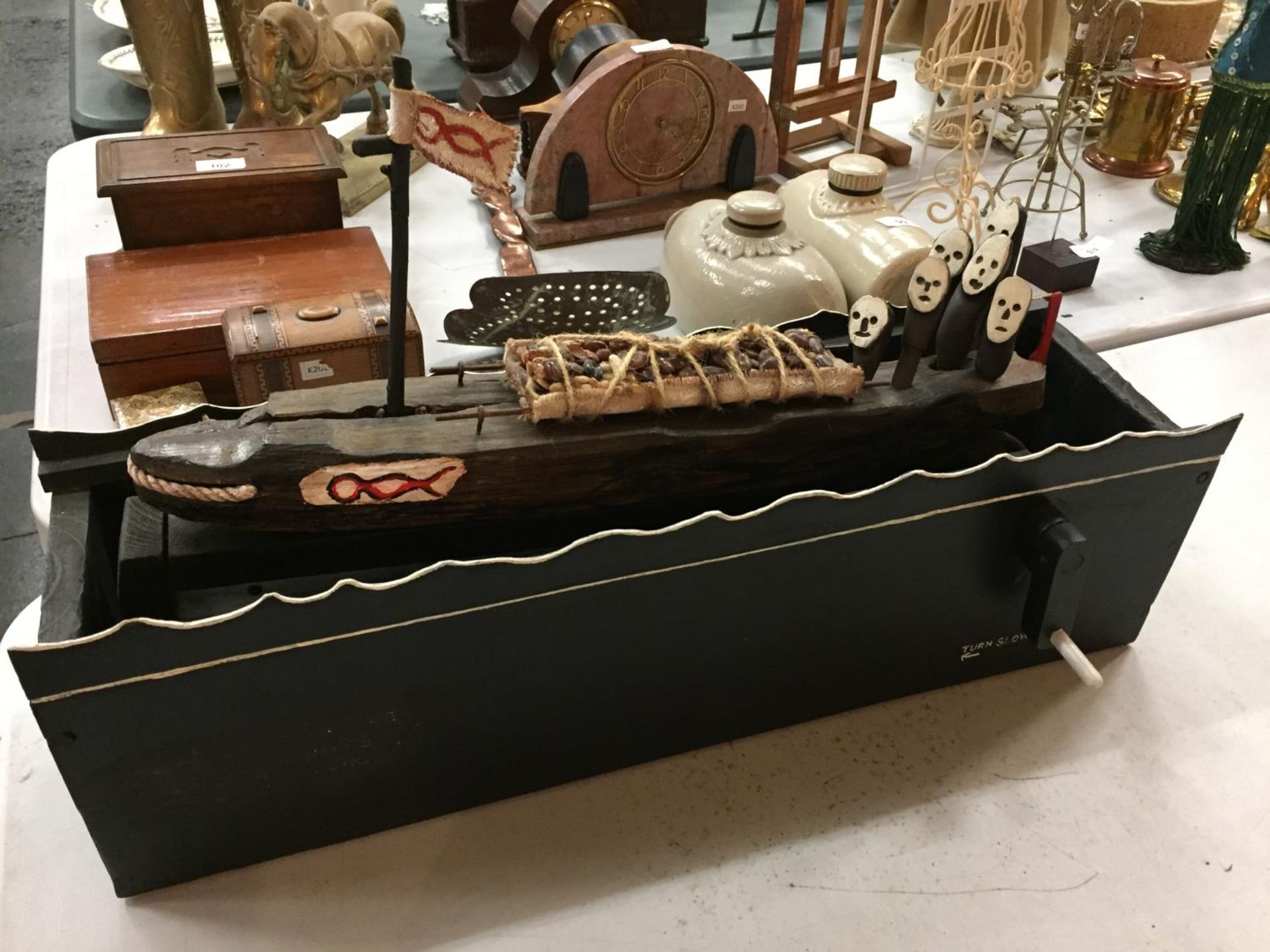 A WOODEN GHOST LIFE BOAT LENGTH 60CM WITH TURNING HANDLE