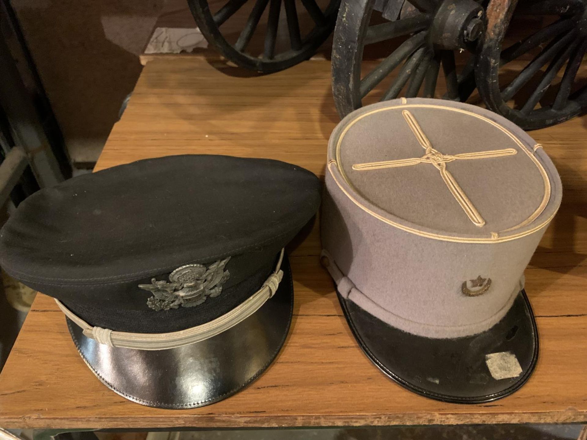 A U.S.A. CAPTAINS PEAKED CAP AND A FRENCH KEPE CAP (2)