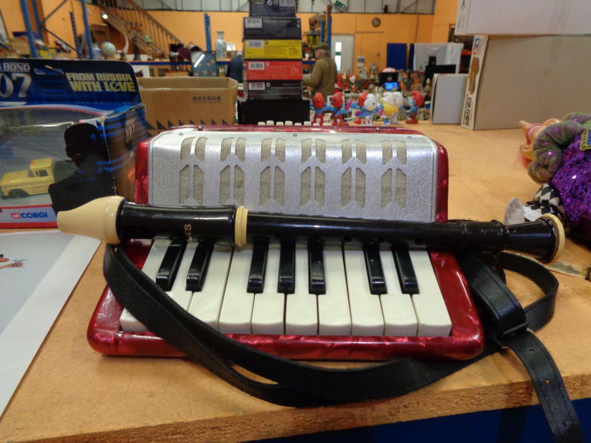 A CHILDS ACCORDIAN AND A RECORDER