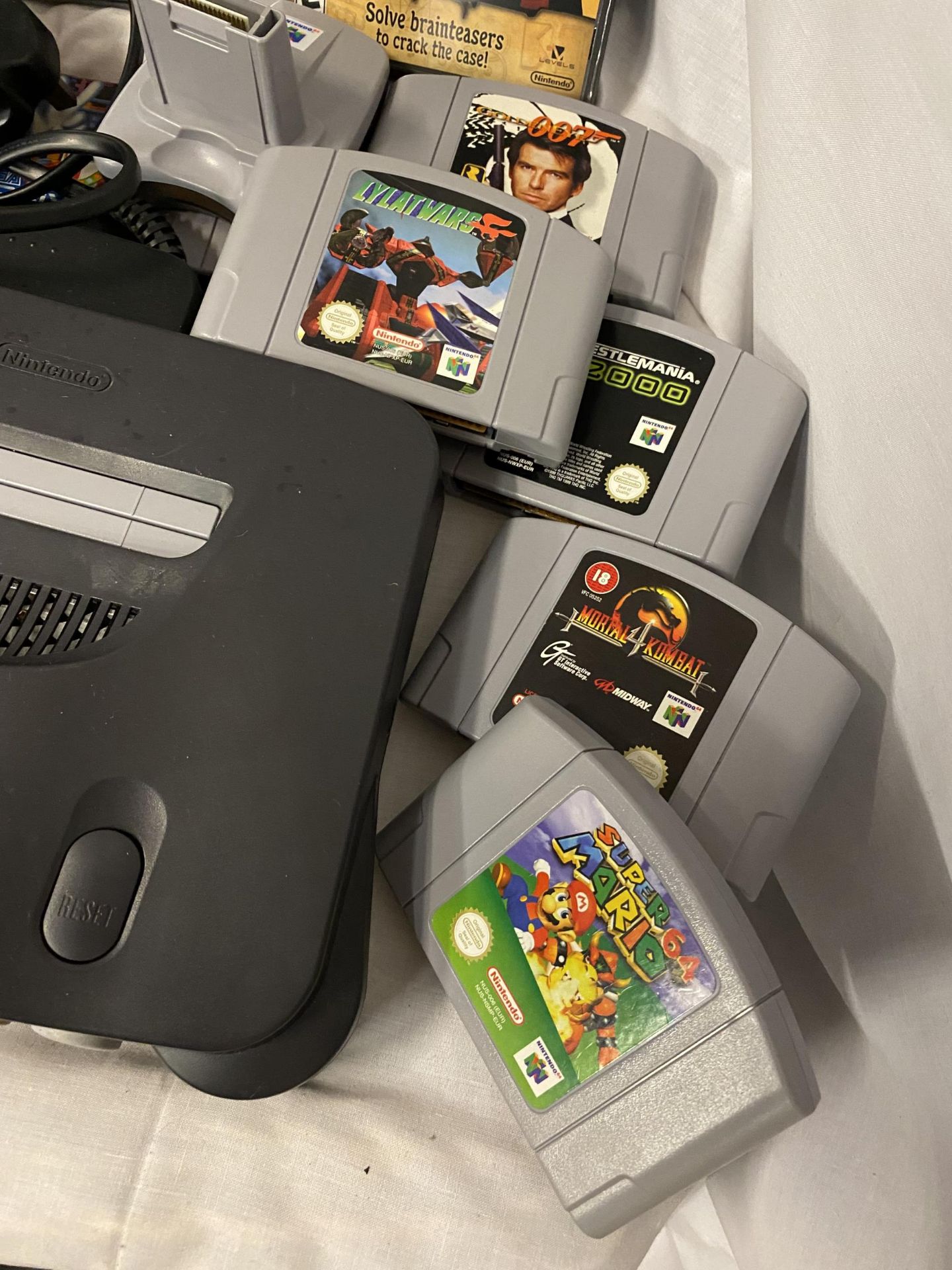 A VINTAGE NINTENO 64 WITH CONTROLLERS AND GAME CARTRIDGES - Image 2 of 5