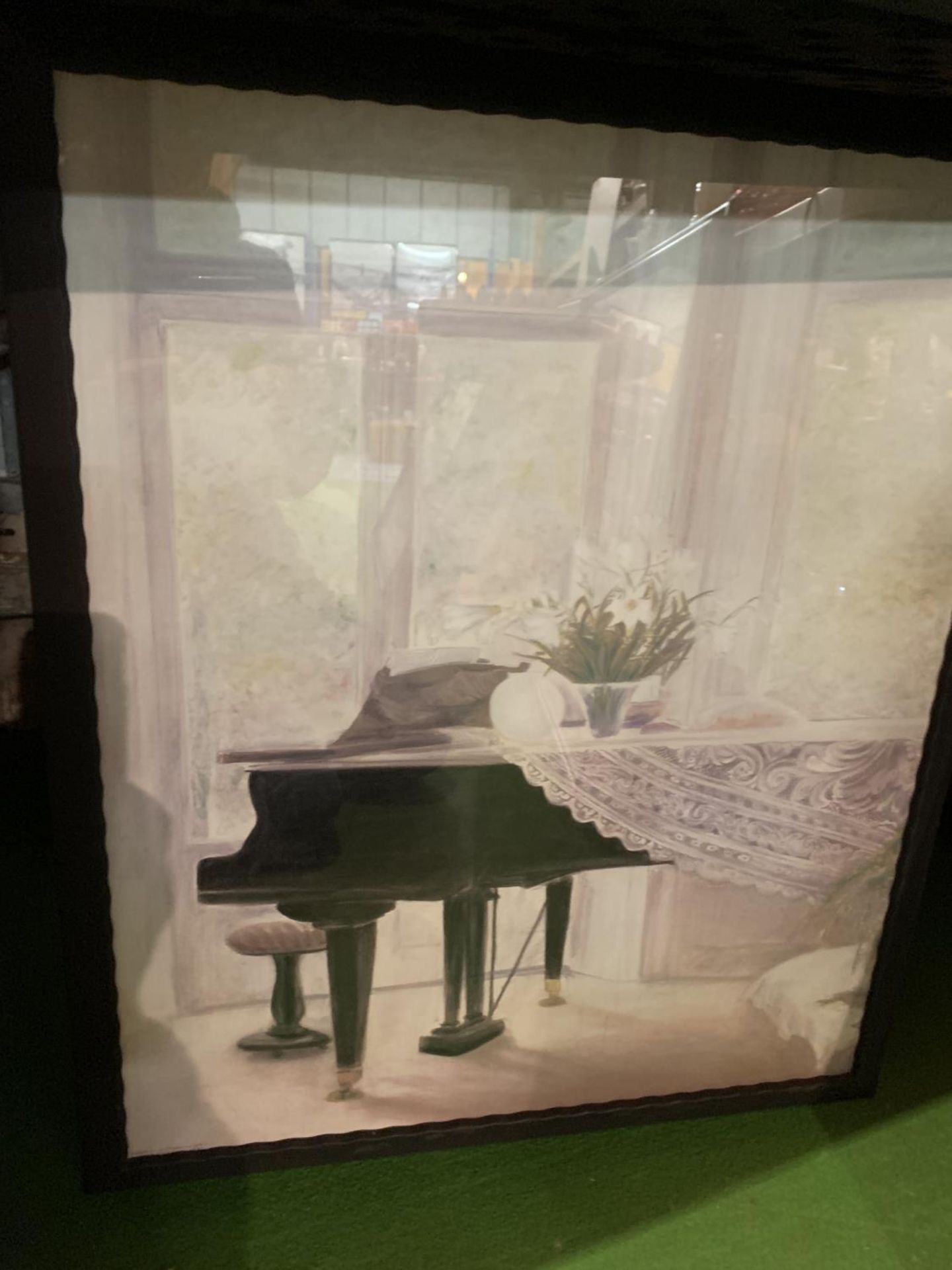 A FRAMED PRINT OF A STUDY OF A PIANO