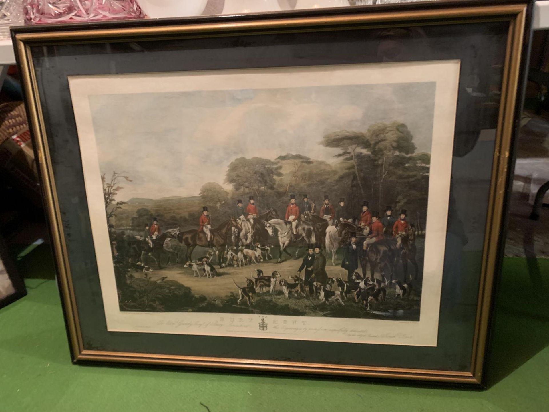 A FRAMED COLOURED ETCHING OF THE BURY HUNT