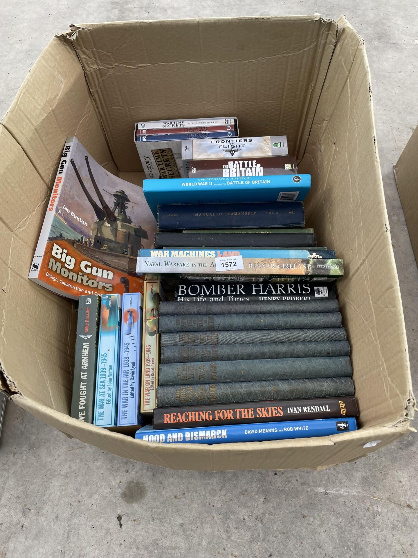 AN ASSORTMENT OF MILITARY BOOKS AND DVDS