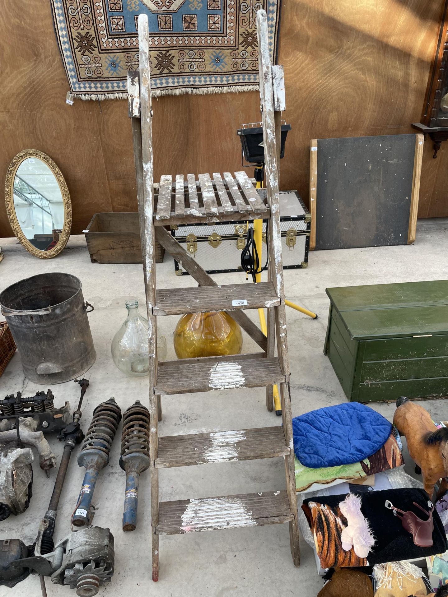 A VINTAGE FOUR RUNG WOODEN STEP LADDER