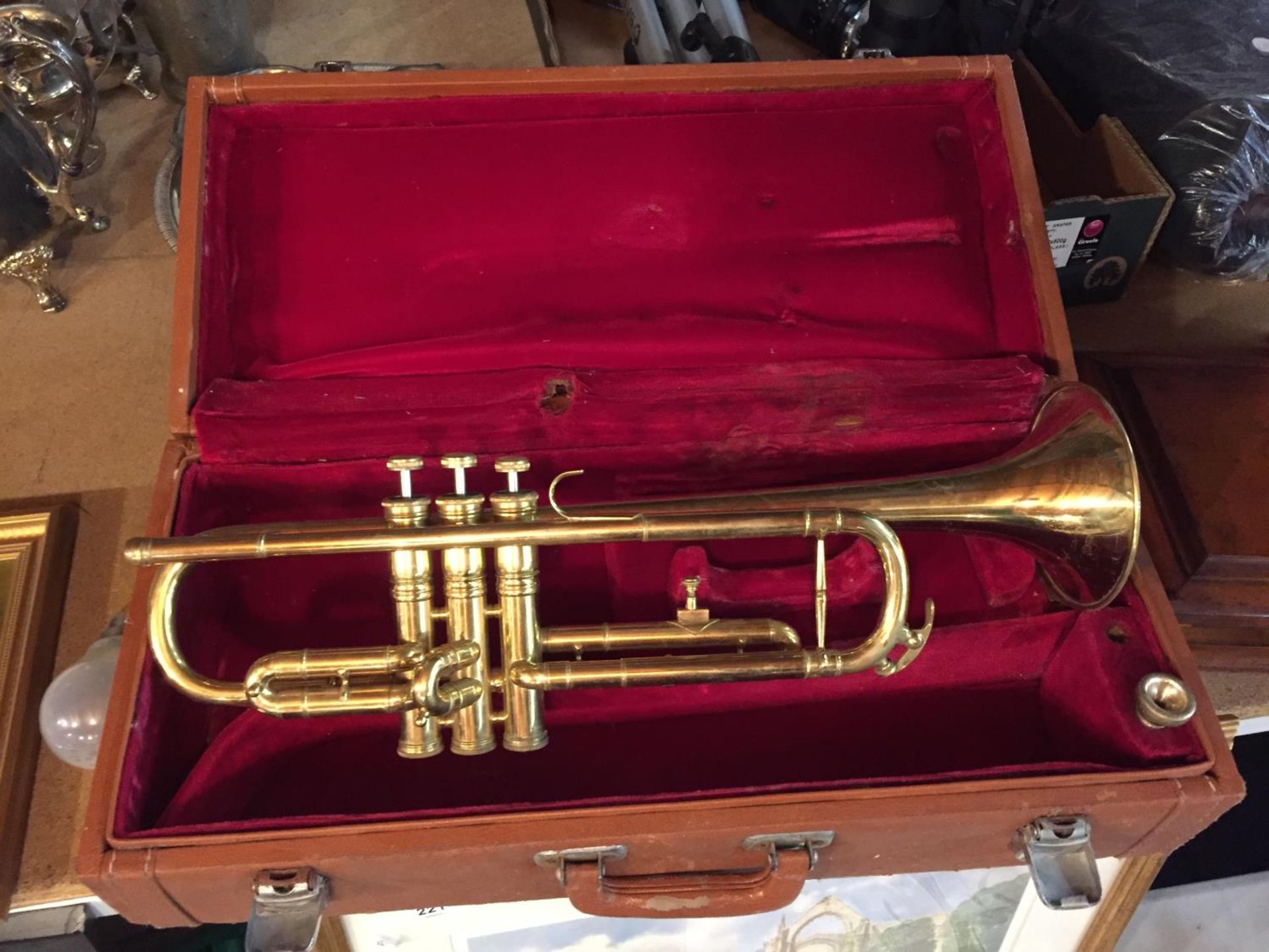 A BRASS TRUMPET WITH CARRYING CASE