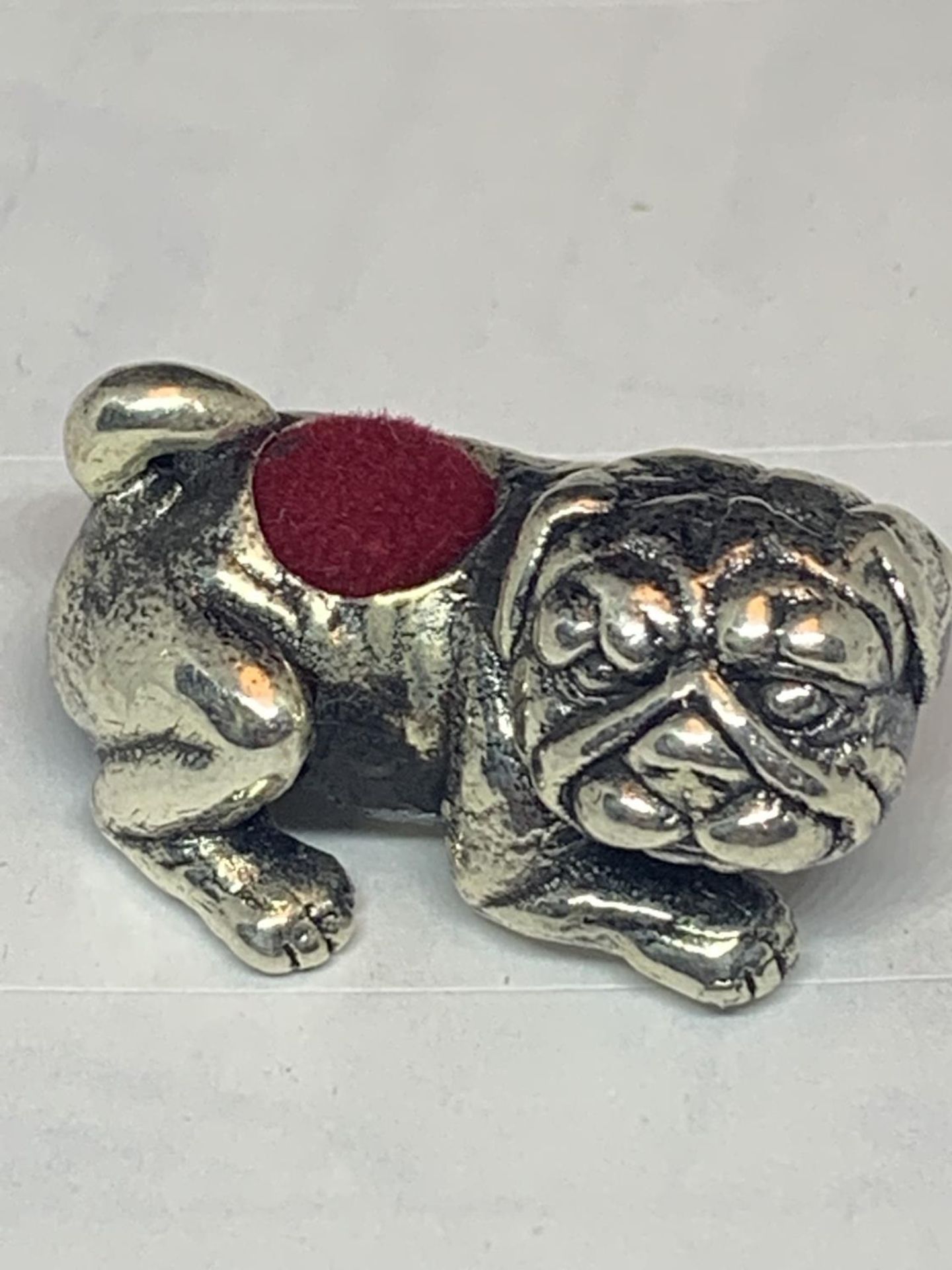 A SILVER BULL DOG PIN CUSHION