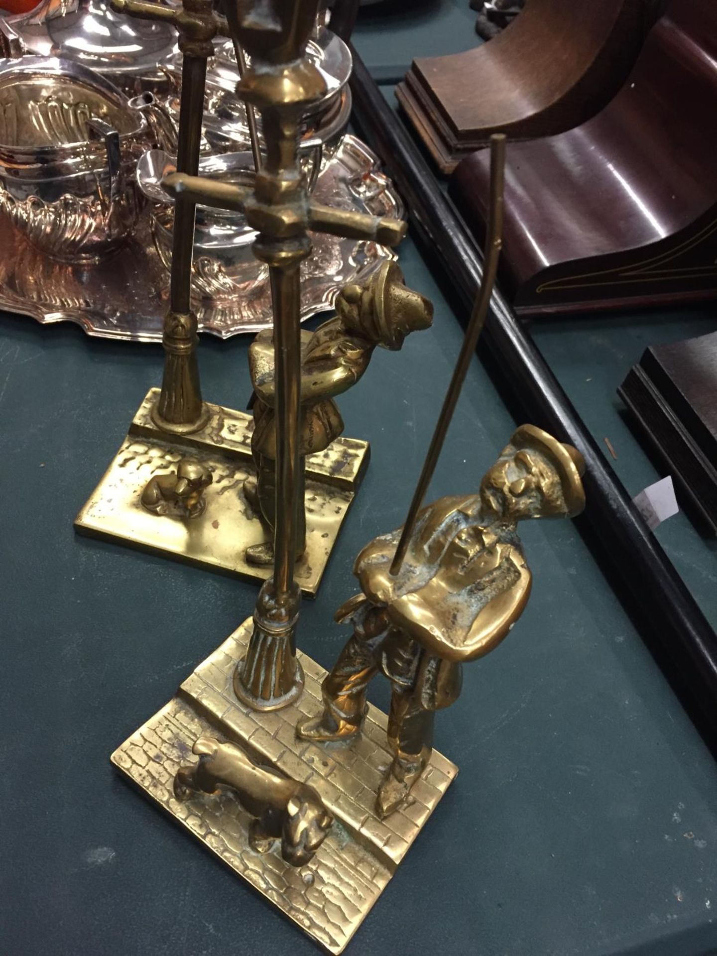 TWO BRASS FIGURES OF STREETLAMP LIGHTERS WITH DOGS - Image 2 of 3