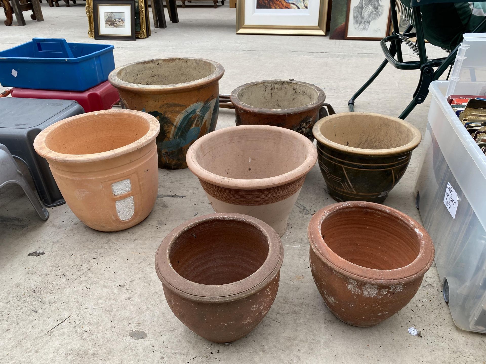 AN ASSORTMENT OF CERAMICA AND TERRACOTTA PLANTERS