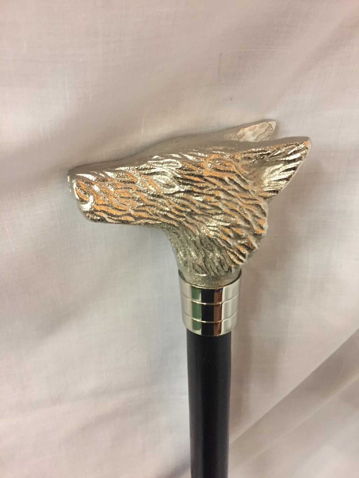 A WOODEN WALKING STICK WITH A WHITE METAL WOLF HEAD - Image 2 of 3