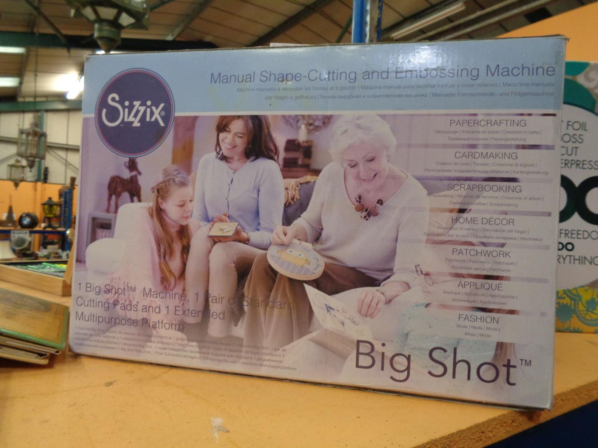 A SIZZIX BIG SHOT MANUAL SHAPE CUTTING AND EMBOSSING MACHINE