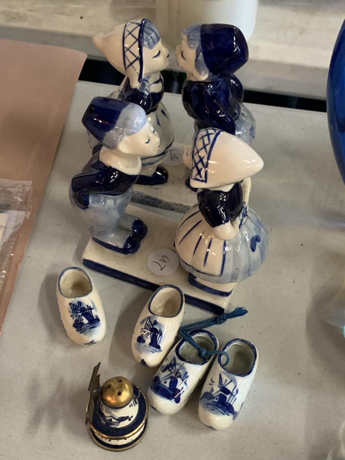 A COLLECTION OF DELFT WARE TO INLCUDE FIGURINES, CLOGS AND A WINDMILL