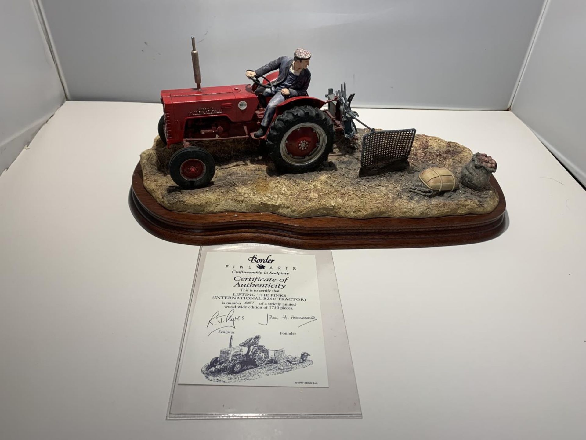 A LARGE LIMITED EDITION BORDER FINE ART FIGURINE LIFTING THE PINKS (INTERNATIONAL B250 TRACTOR)