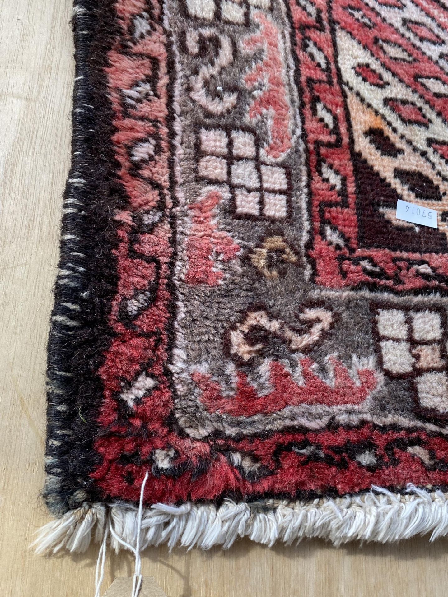 A RED PATTERNED FRINGED RUG - Image 2 of 2