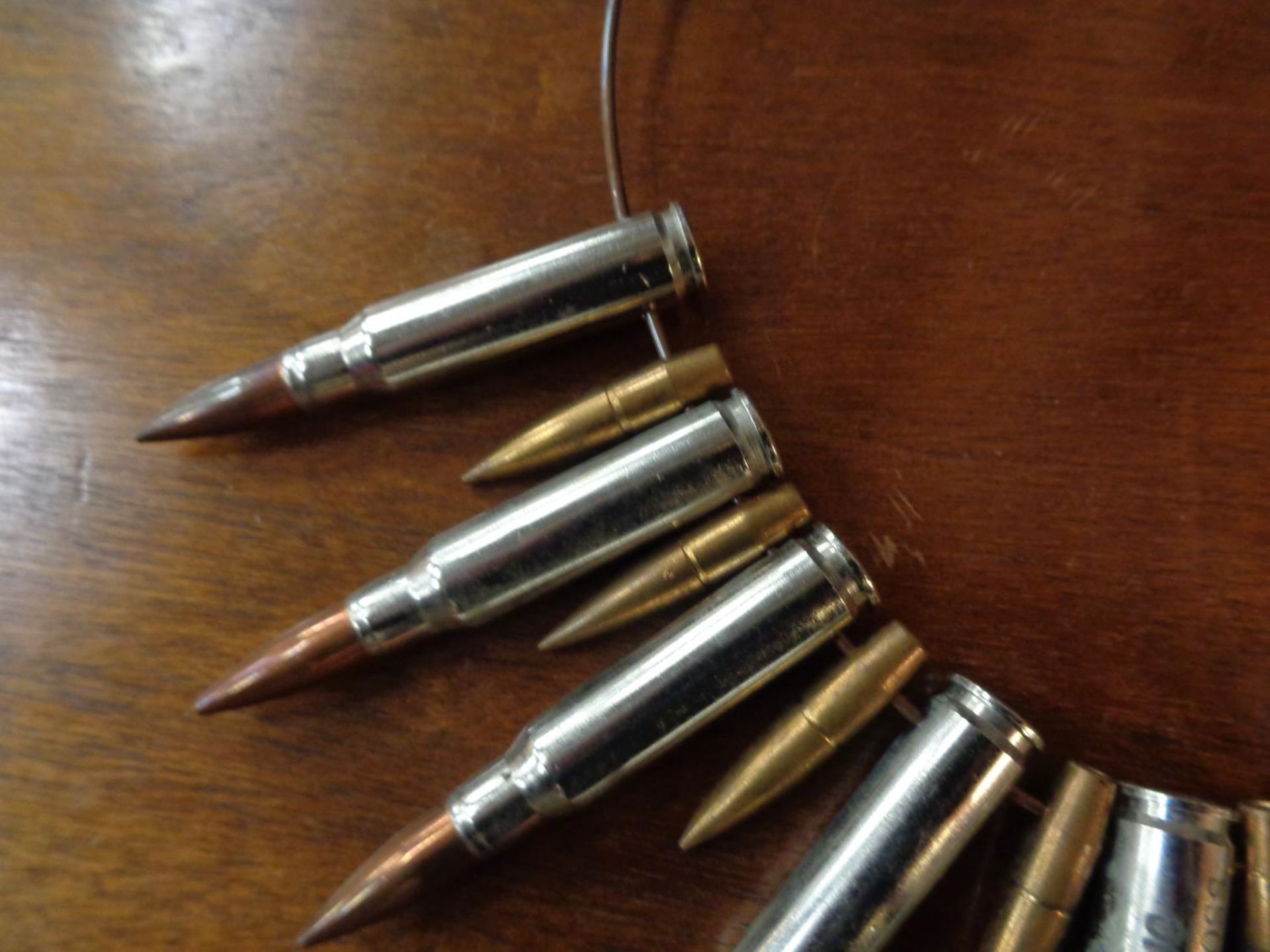 A NECKLACE MADE OF BULLETS STAMPED 'BANG BANG BY CAREN ROSS' - Image 3 of 3