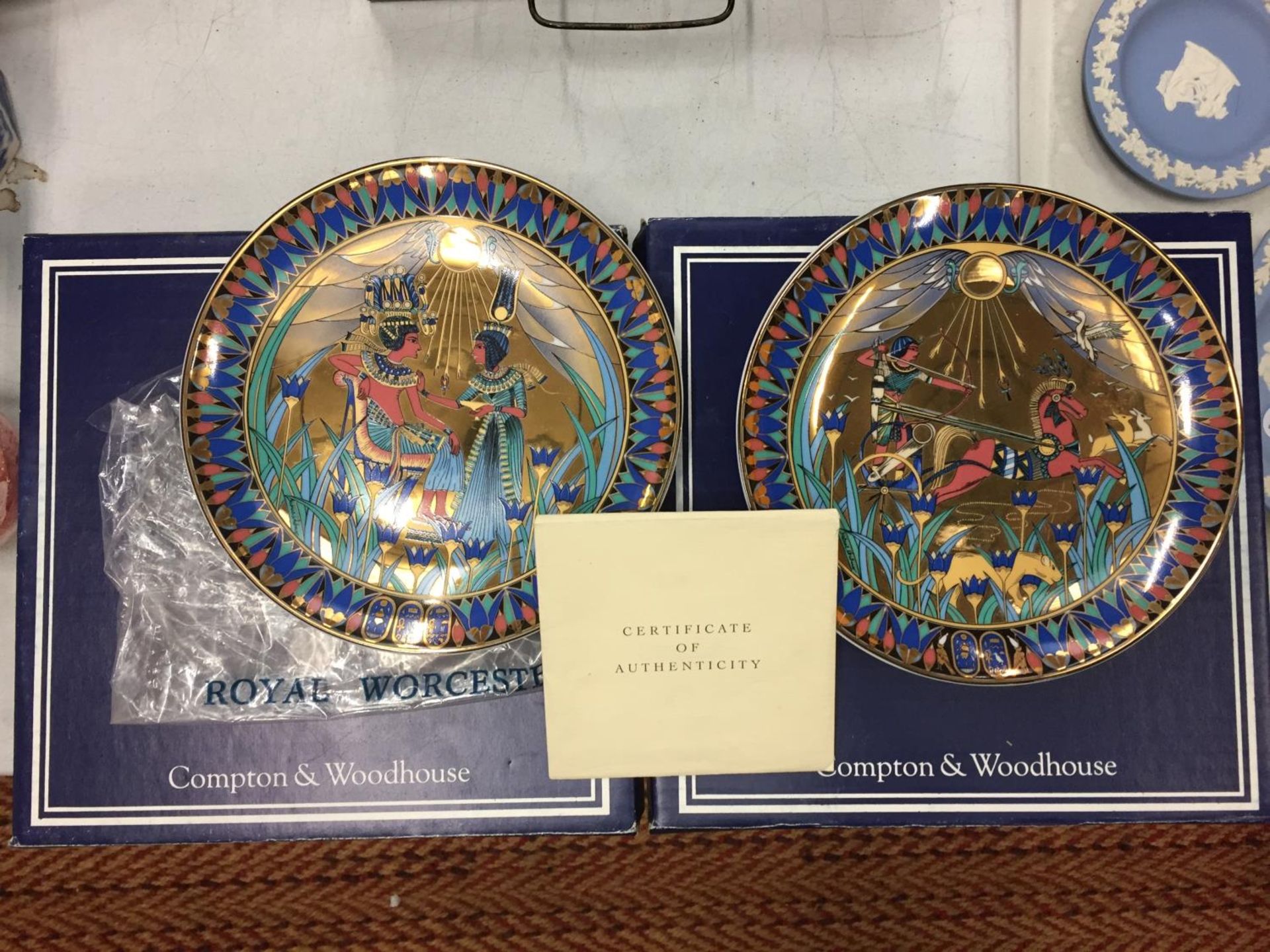 TWO EGYPTIAN STYLE BOXED PLATES