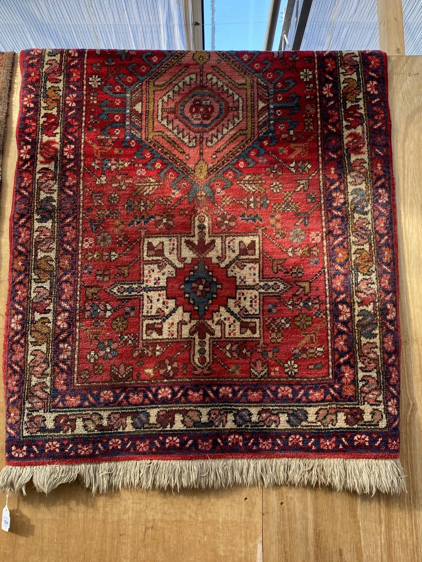 A RED PATTERNED RUG