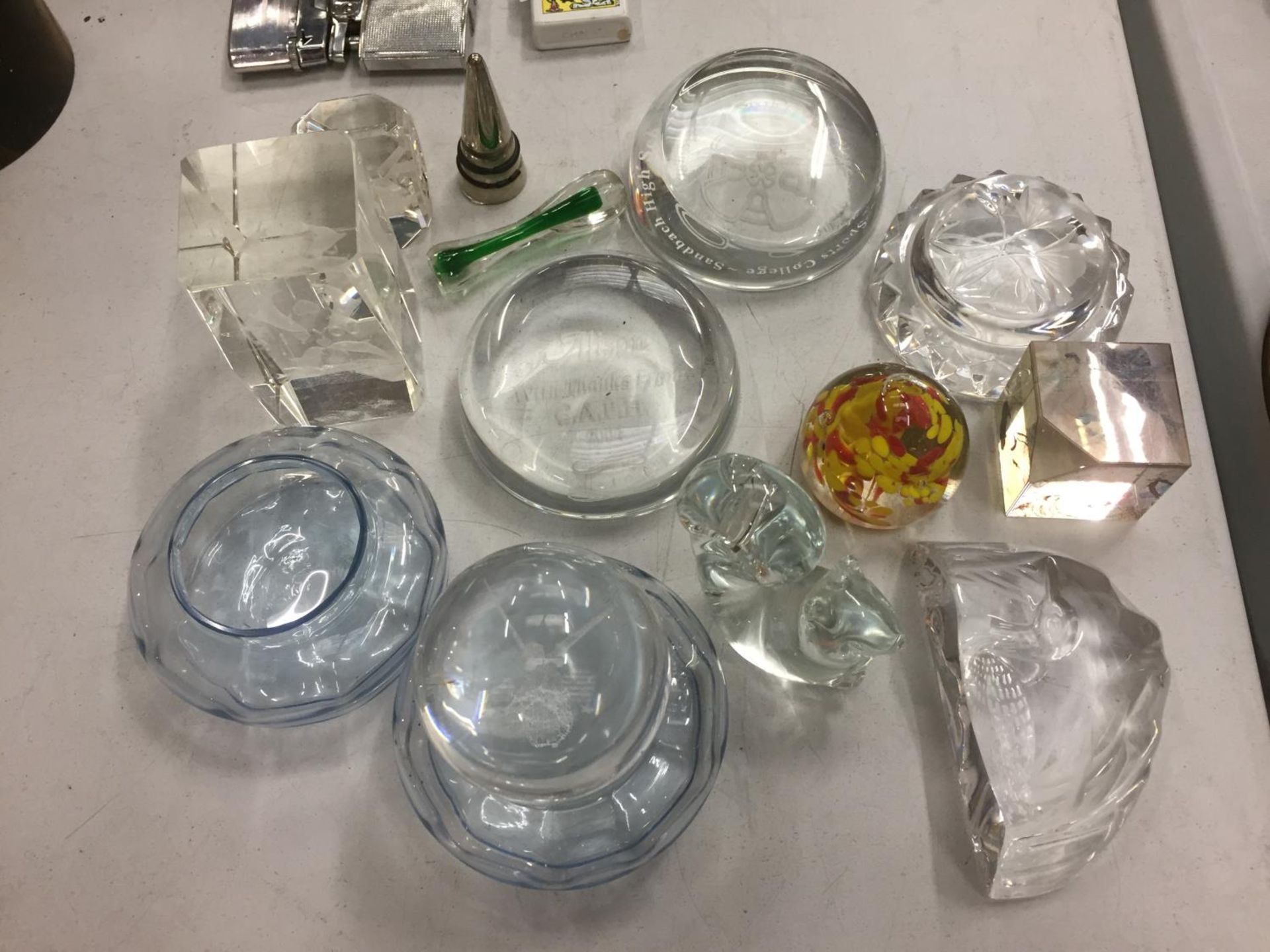 A COLLECTION OF GLASS PAPERWEIGHTS OF VARIOUS DESIGNS