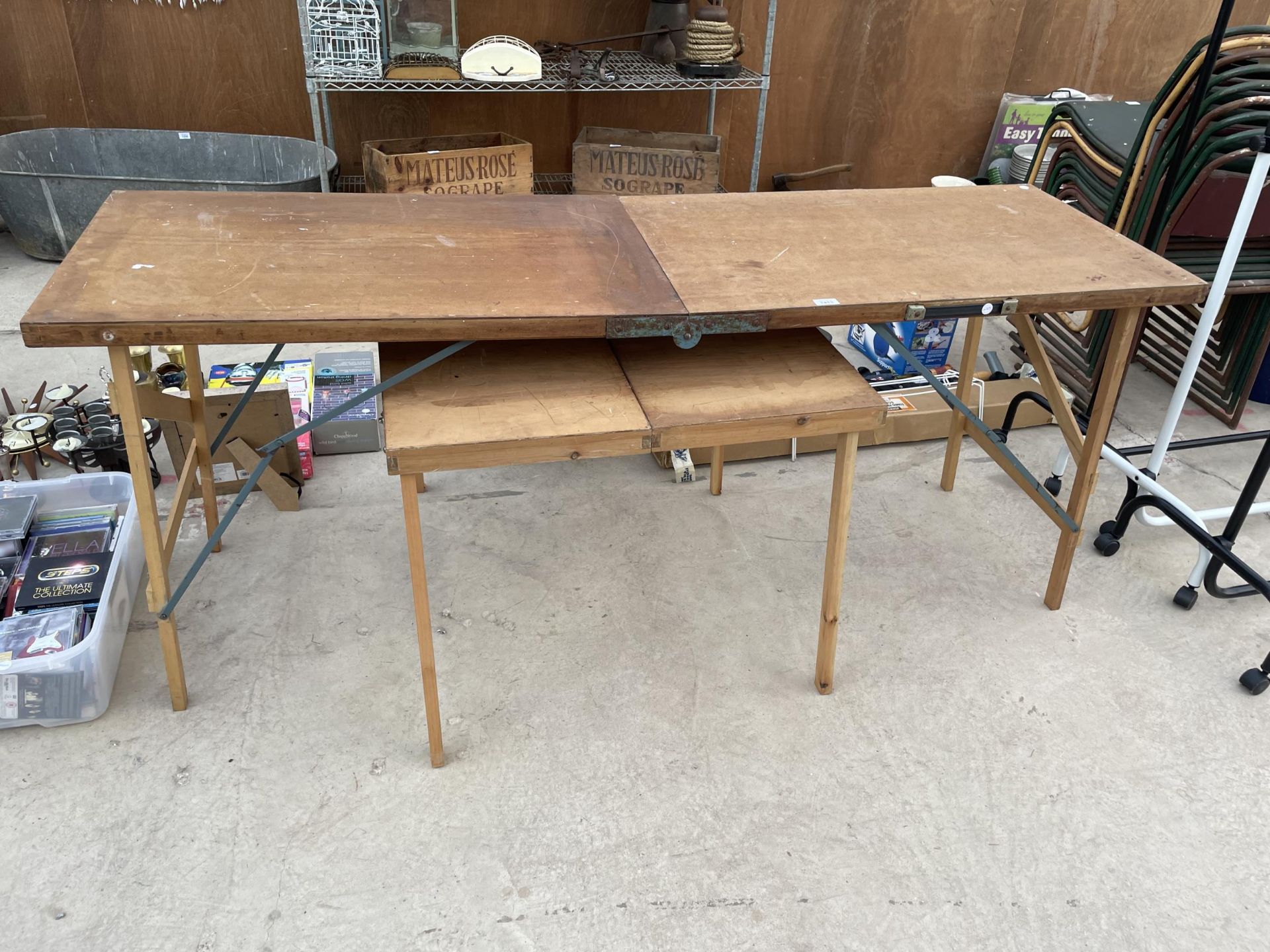 TWO FOLDING WOODEN PASTING TABLES