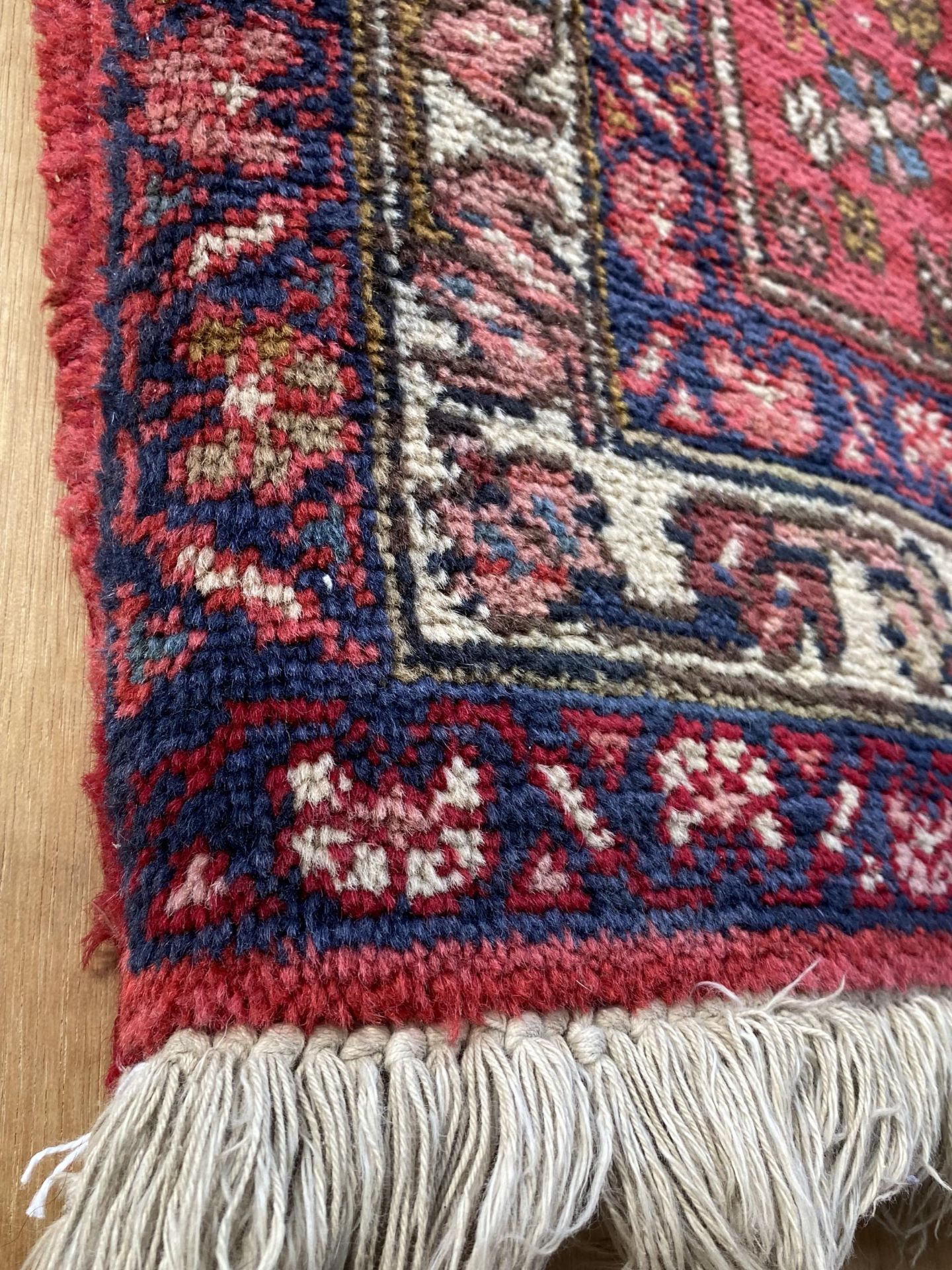 A RED PATTERNED RUG - Image 2 of 2