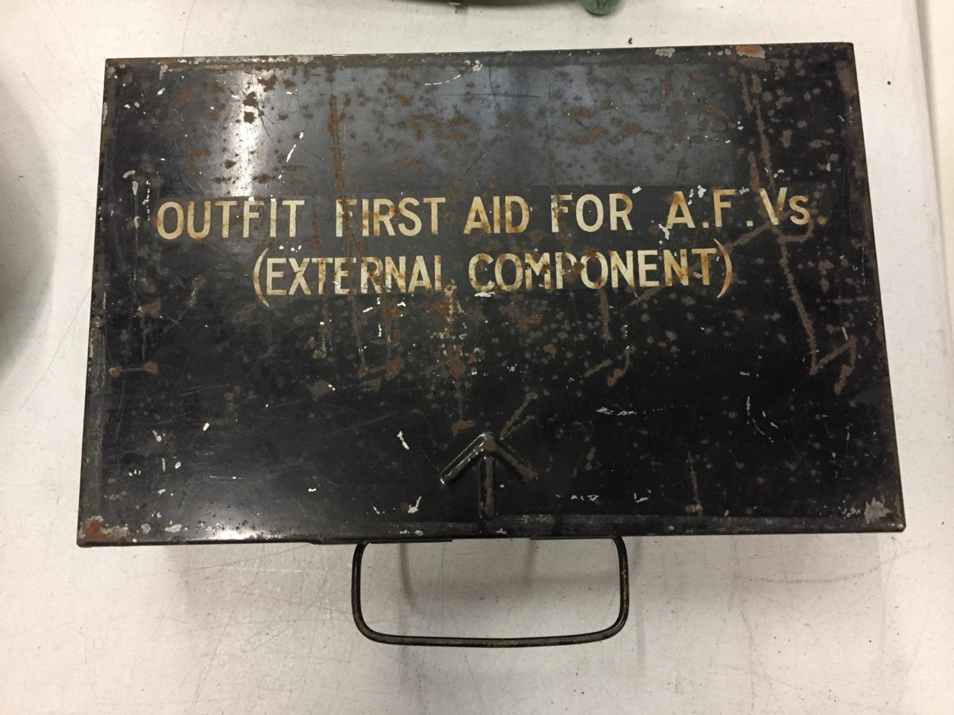 A VINTAGE MILITARY FIRST AID KIT TIN