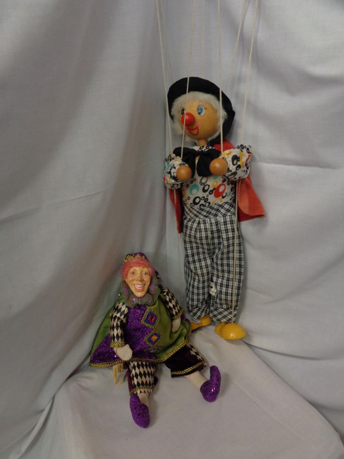 TWO ITEMS TO INCLUDE A HARRODS ELECTRIZZARE ACTOR DOLL WITH LABEL AND A WOODEN CLOWN PUPPET WITH