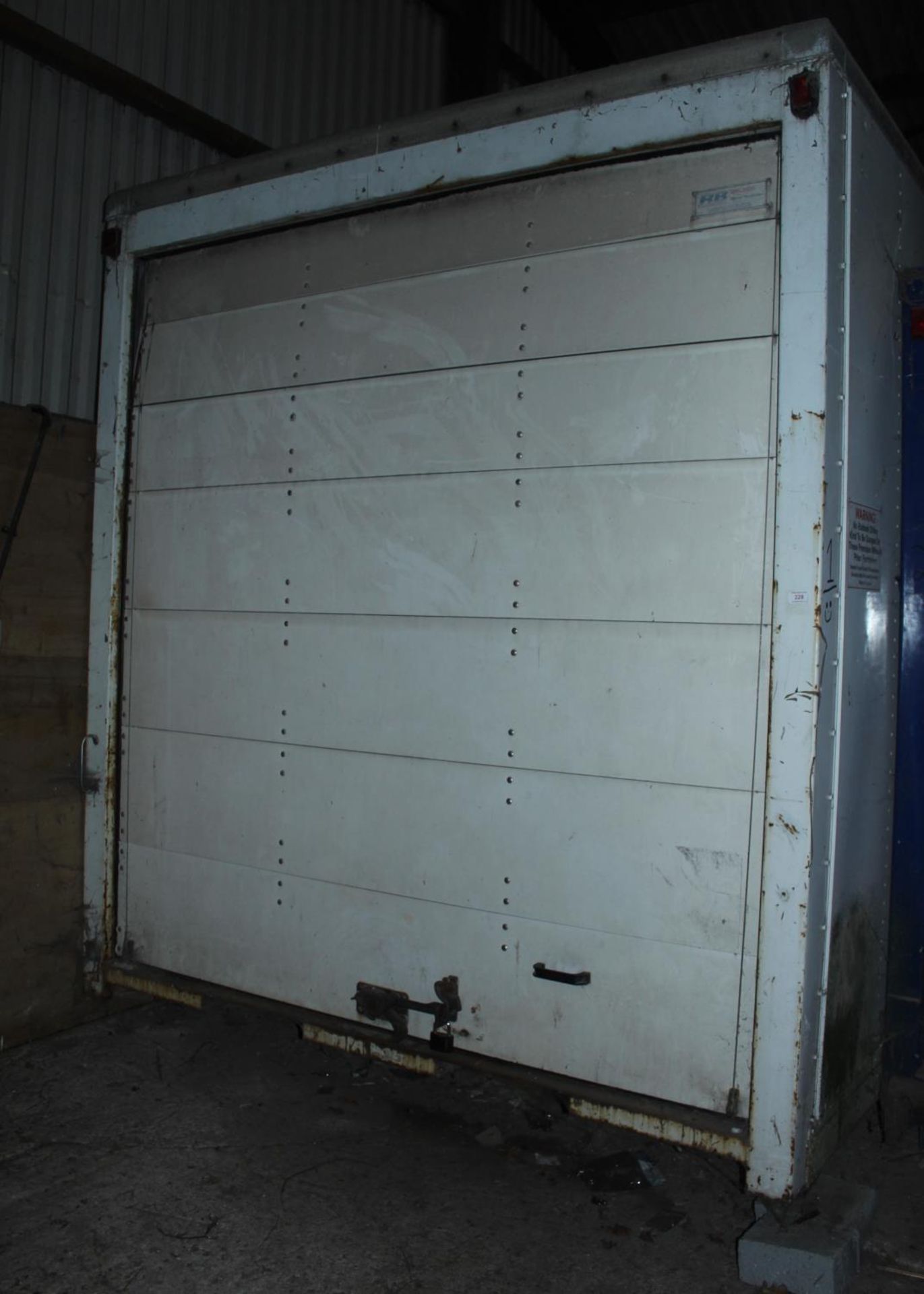 A LORRY BODY 20'2" LONG 7'11" WIDE 9'4" HIGH WITH DAMAGED FRONT CORNER, STORED INSIDE