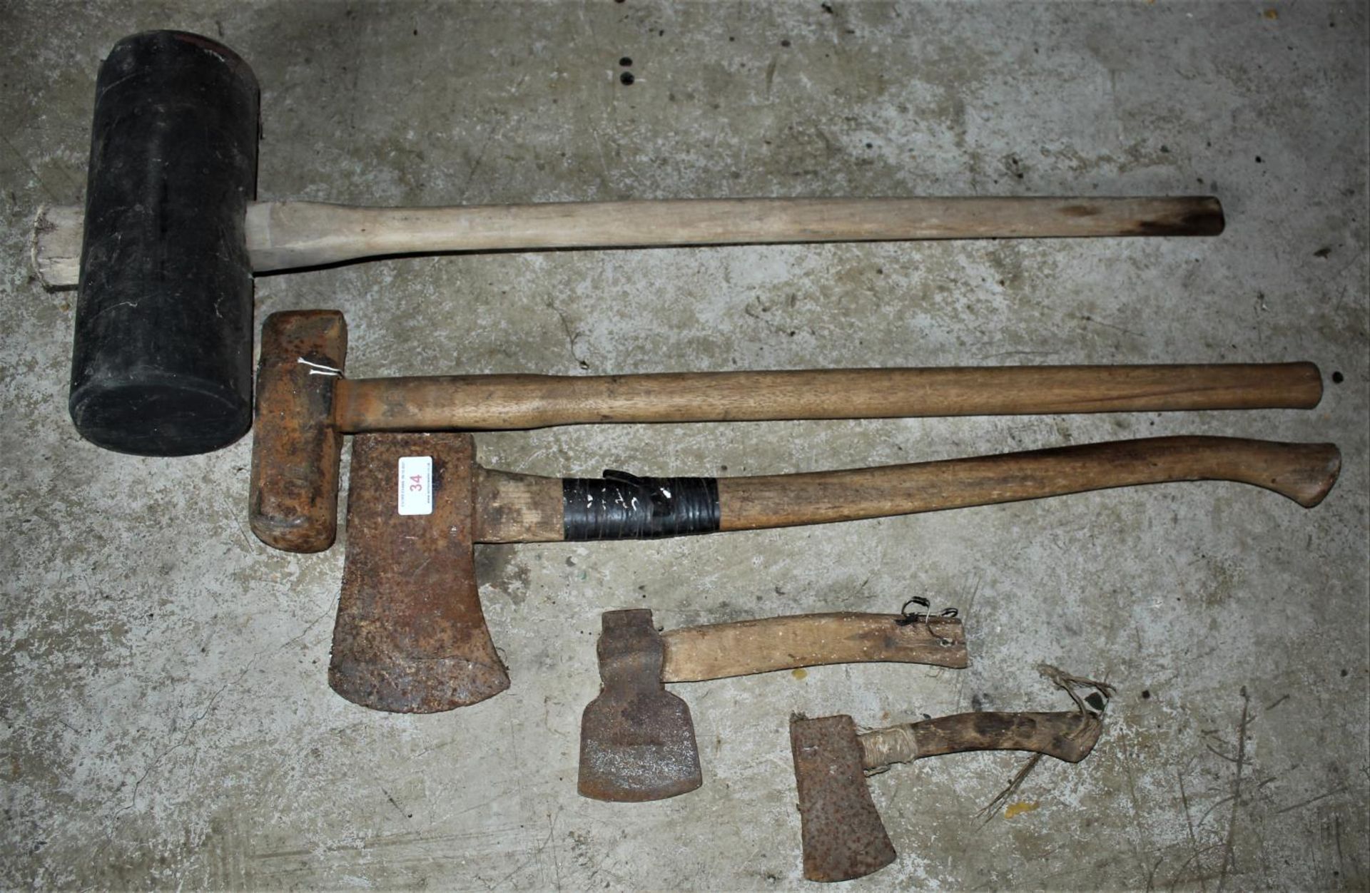 A RUBBER MAUL, SLEDGE HAMMER & THREE AXES