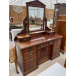 A LATE VICTORIAN MAHOGANY DRESSING TABLE, 55" WIDE, ENCLOSING DRAWERS AND CENTRAL CUPBOARD