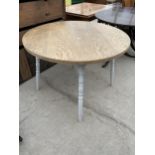 A MODERN KITCHEN TABLE ON TURNED LEGS, 42" DIAMETER
