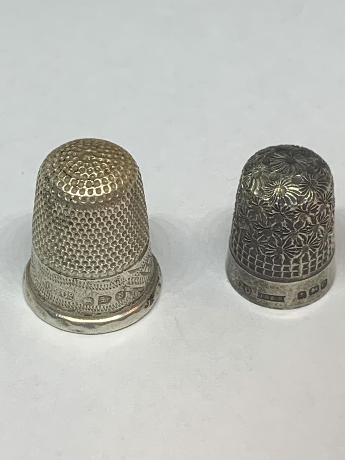 TWO HALLMARKED SILVER THIMBLES